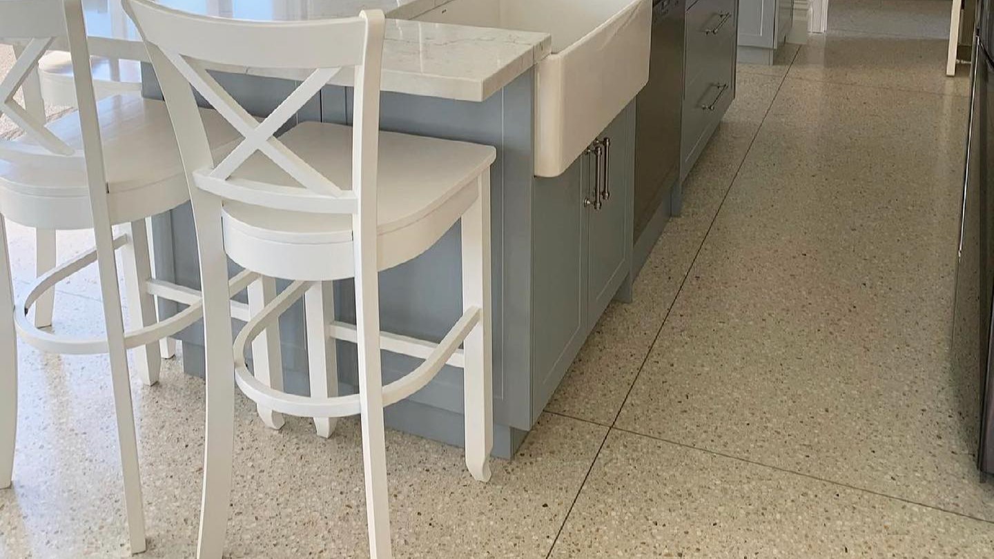 Coloured exposed aggregate concrete on kitchen floor